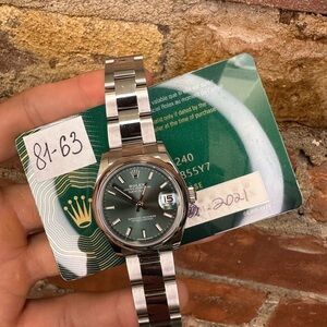 Rolex Oyster Perpetual with Silver Band and Green Dial